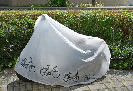 Motorbike covered with plastic protectorの写真素材