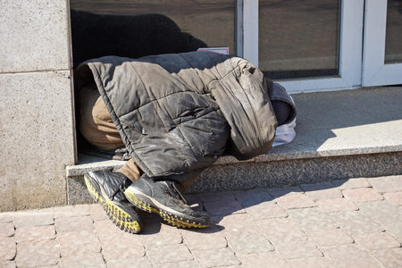 Homeless man sleeps on the street