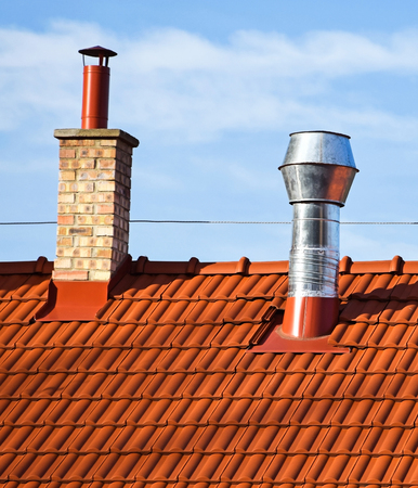 Roof of a house with smoke stacksの写真素材