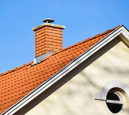 House roof with smoke stackの写真素材