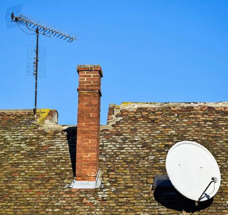 Antennas on the roof of an old buildingの写真素材
