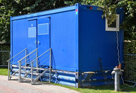 Toilet in a mobile container outdoorsの写真素材