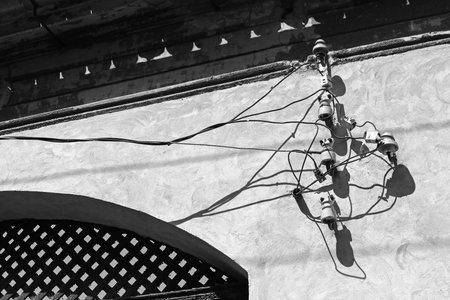Eletcticity cables and telephone lines on the wall