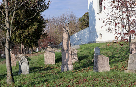 Tombstones in the old cemetery near a chapel