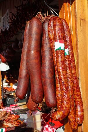 Sausages and salamis at the butcher shopの写真素材