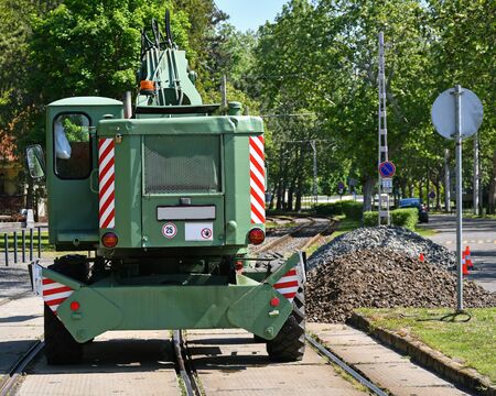 Grabber excavator stands at the railway constructionの写真素材