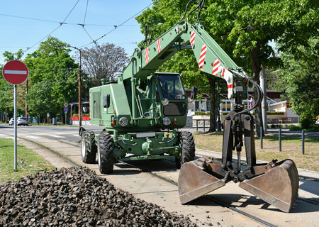 Grabber excavator stands at the railway construction