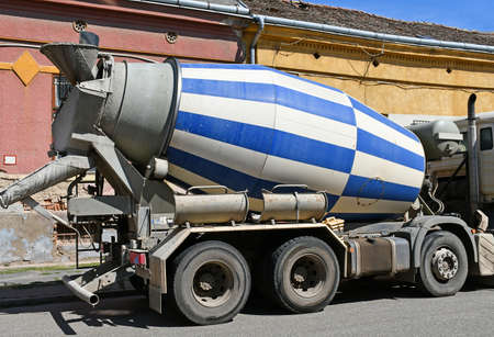 Cement mixer truck at the construction siteの写真素材