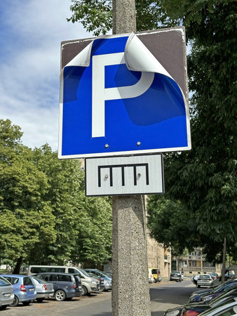 Damaged parking lot sign in the cityの写真素材