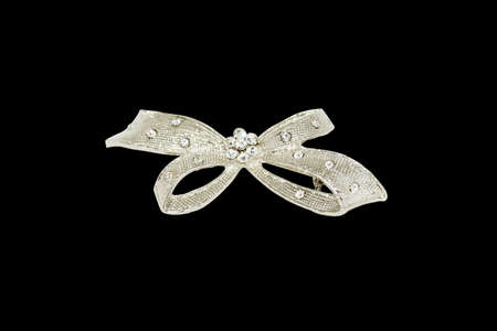 brooch in the shape of a bow isolated on a white backgroundの写真素材