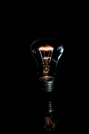 lighted lamp on a black backgroundの写真素材