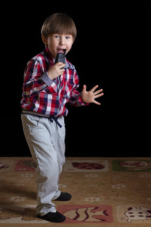 happy children playing on a black backgroundの写真素材