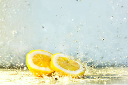 Lemon water drops fresh citrus yellow freshnessの写真素材