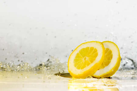 Lemon water drops fresh citrus yellow freshnessの写真素材