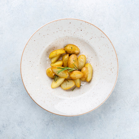 Roasted potatoes with rosemary. Selective focusの写真素材