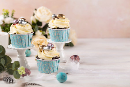 Spring Easter cupcakes and easter eggs on the white table. Easter concept