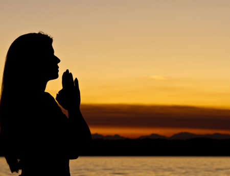 Woman meditates outdoorsの写真素材