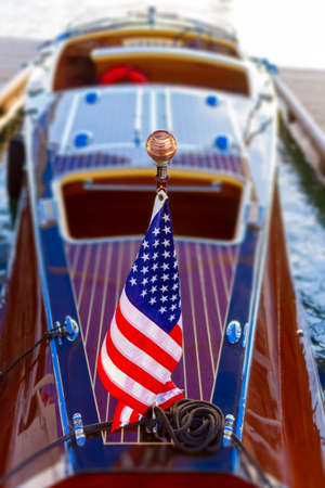 Wooden boat proudly displays American flagの写真素材