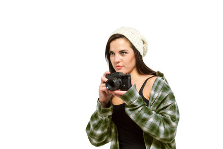 Young woman with brown hair holds camera and takes pictures