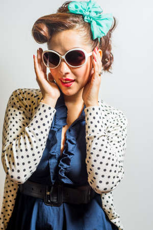 Attractive female in vintage or retro modest yet fun fashion styleの写真素材