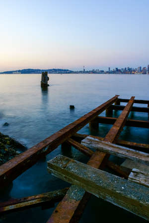 Seattle Cityscape At Dusk With Abandoned Steel Pier In Foregroundの写真素材