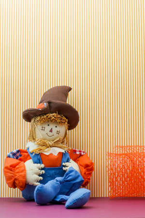 Seated Silly Scarecrow holds its overalls britchesの写真素材