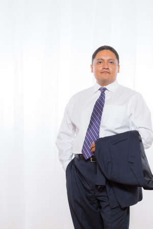 Middle aged hispanic male in suit with confident expressionsの写真素材