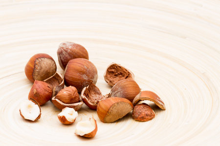 Shelled and unshelled Filbert nuts served on a dish