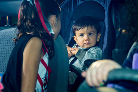 Mom And Sister Doding Over Male Toddlerの写真素材