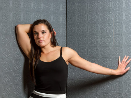 Young healthy female with long hair and toned muscular buildの写真素材