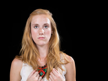 Young caucasian female expression portrait isolated on black backgroundの写真素材