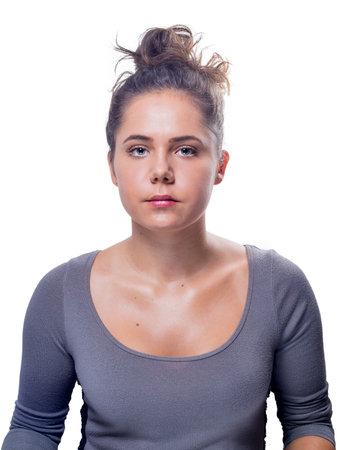 Beautiful young white female with soft olive skin, gray eyes and brown updo hair.の写真素材