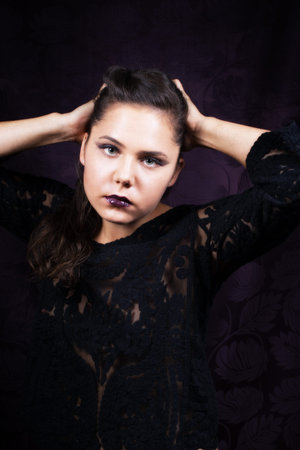 Dramatic portrait of  female in black lacy blouseの写真素材