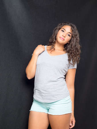 Attractive Young Woman Leaning Against Wallの写真素材