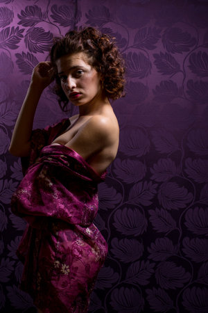 Attractive Panamanian American woman in vibrant purple floral robe