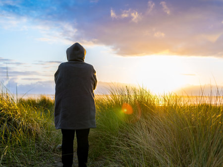Woman Taking Walk At The Beachの写真素材