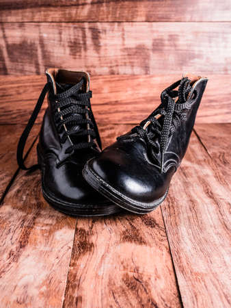Young Boys Worn Leather Bootsの写真素材