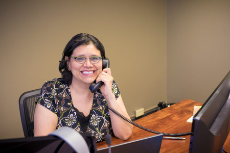 Gen-X Woman Works At Office Desk
