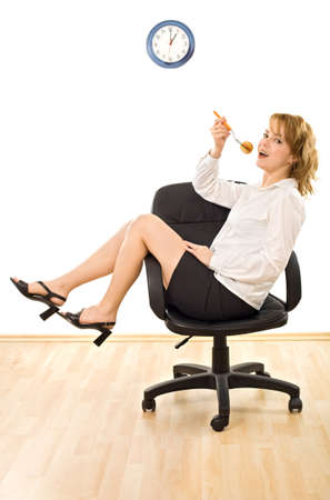 Young beautiful businesswoman is in lunch-time - isolatedの写真素材