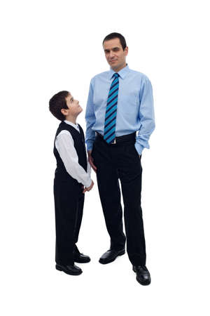 Little boy looking up at his father and longing for appreciationの写真素材