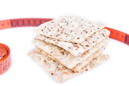 cracker with a measuring tape isolated on whiteの写真素材