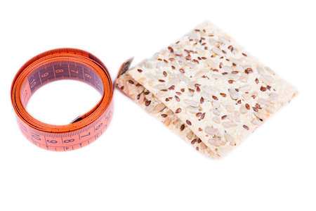 cracker with a measuring tape isolated on whiteの写真素材