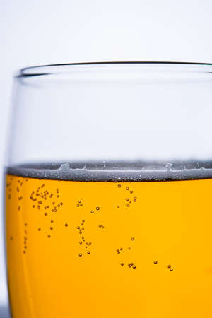 Fresh beer with froth and condensed water pearlsの写真素材