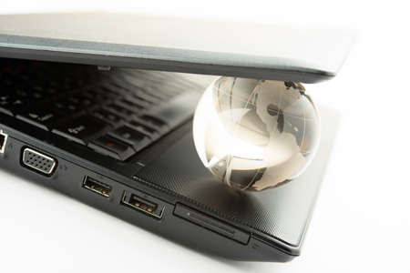 globe on a laptop keyboardの写真素材