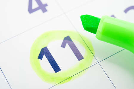 Green marker and open calendarの写真素材