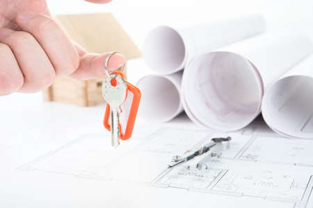 Blueprints hand with keysの写真素材