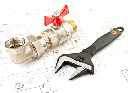 spanner and fitting on a draft background