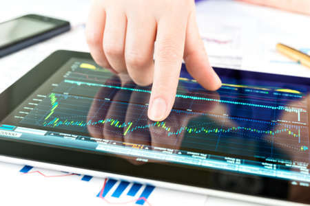 Businesswoman work with documents and tablet pc Businesswoman work with documents and tablet pc