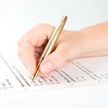 Filling of questionnaire by a ball point penの写真素材