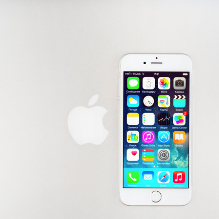 SIMFEROPOL, RUSSIA - NOVEMBER 03, 2014: Apple iPhone 6 over Macbook cover displaying iOS 8.1...
